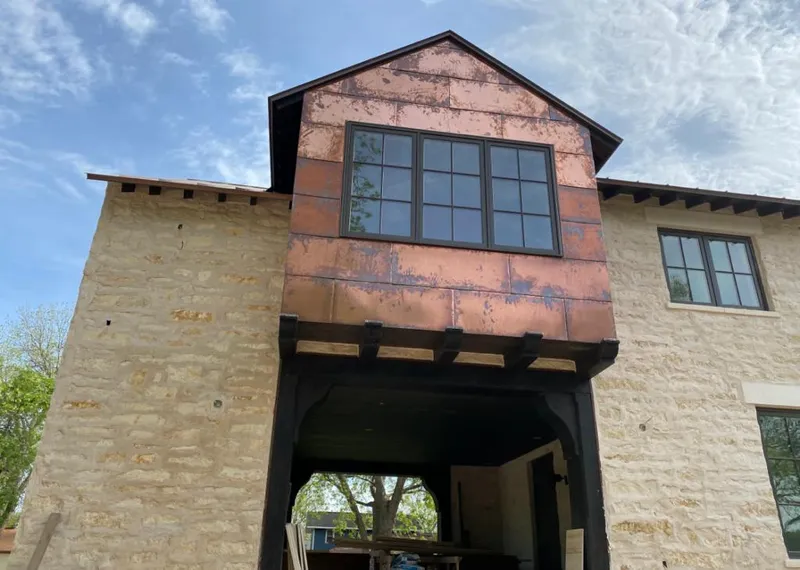 Copper metal panel facade on a stone building for Metal Roof Coating in Midway
